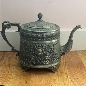 Vintage solid pewter teapot hand carved